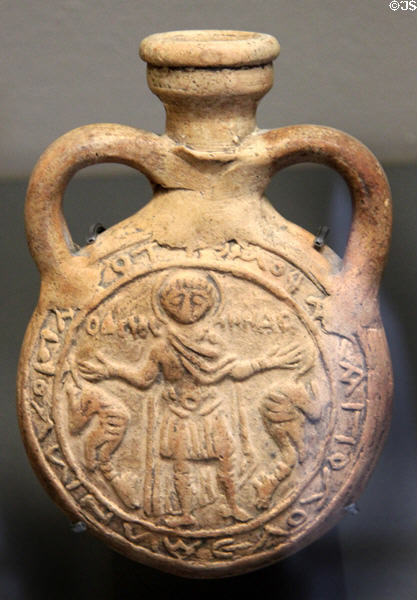 Clay flask with eulogy to Coptic St Menas (6th-7thC) from Egypt at Louvre Museum. Paris, France.