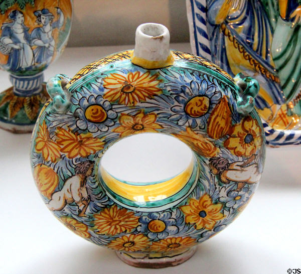 Ceramic torus gourd painted with putti & sunflowers (1680) from Nevers, France at Sèvres National Ceramic Museum. Paris, France.