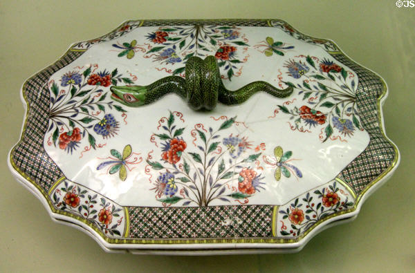Chinese porcelain covered soup tureen (1715-50) from Jingdezhen with further painting by factory Guillebaud of Rouen, France at Sèvres National Ceramic Museum. Paris, France.