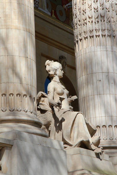 Seated figure sculpted on Grand Palais. Paris, France.