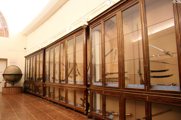 Cases of antique naval hand weapons at Musée de la Marine. Paris, France.