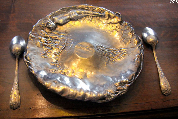 Metal plate with female figure at Maxim's Art Nouveau Collection 1900. Paris, France.