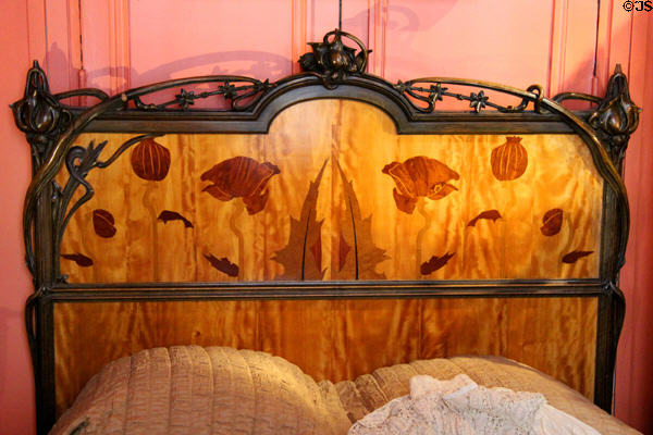 Art Nouveau marquetry bedroom headboard at Maxim's Art Nouveau Collection 1900. Paris, France.