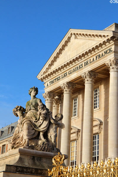 Southern Versailles Palace wing with cornucopia figure statue. Versailles, France.