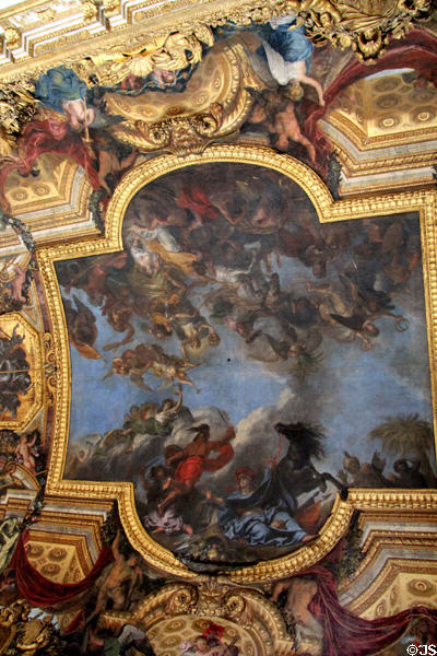 Ceiling painting by Charles Le Brun in Hall of Mirrors at Versailles Palace. Versailles, France.
