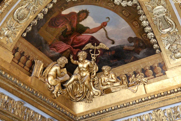 Queen's wing Nobles antechamber later ceiling carvings over earlier Louis XIV era painting at Versailles Palace. Versailles, France.