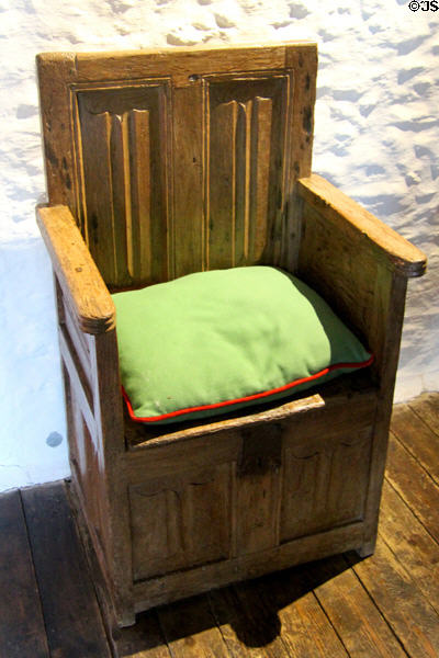 Great chair, which would have been reserved for master of house, with linen fold carving on back at Cartier Manor House Museum. St Malo, France.