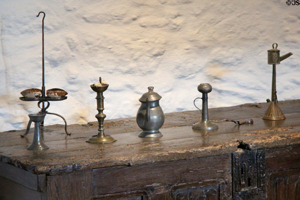 Early lighting fixtures on display at Jacques Cartier Manor House Museum. St Malo, France.