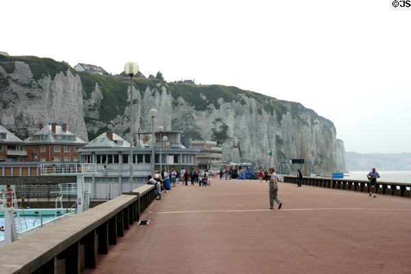 Promenade along ocean ending at white cliffs. Dieppe, France.