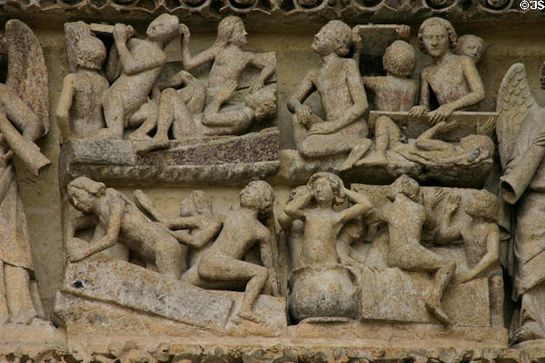 Souls rising from graves on Last Judgment carving of Amiens Cathedral. Amiens, France.