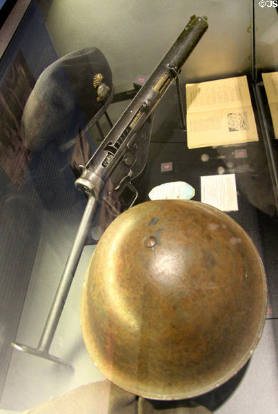 Sten gun between beret of Sherbrooke Fusiliers & Mk III helmet worn by Canadian troops on D-Day at Juno Beach Centre. Courseulles-sur-Mer, France.