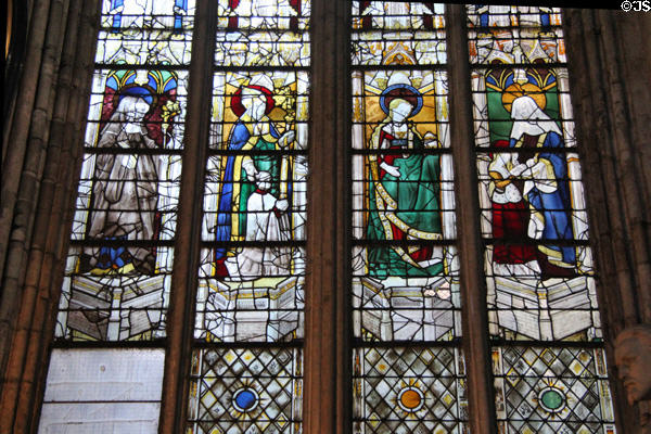 Stained glass windows (1465-70) by Guillaume Barbe of St Clare, a Bishop, St Mary Magdalene, & St Anne teaching the virgin at Rouen Cathedral. Rouen, France.