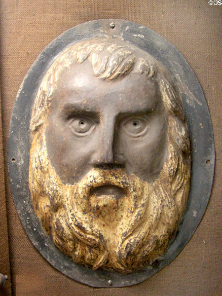 Iron wall sign of A la Barbe d'Or barber shop (19thC) from Paris at Wrought Iron Museum. Rouen, France.