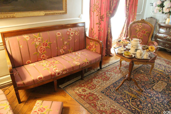 Empire cherry-wood sofa in Petit Salon at Cheverny Chateau. Cheverny, France.