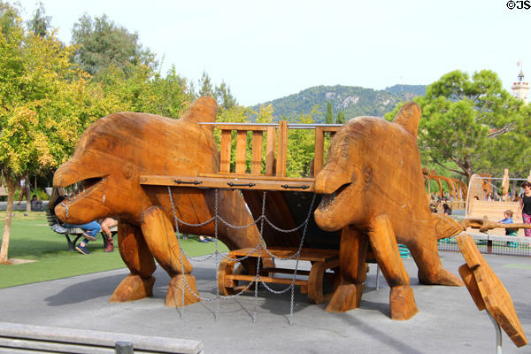 Children's play area with wooden porpoise climbing area at Promenade du Paillon. Nice, France.