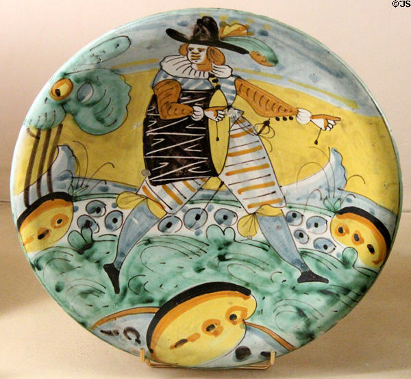 Ceramic deep plate painted with man playing drum (1620-40) at Musées des Arts Décoratifs. Lyon, France.