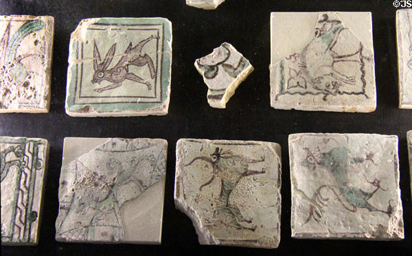 Surviving ceramic floor tiles with rabbit & animal paintings at Papal Palace. Avignon, France.