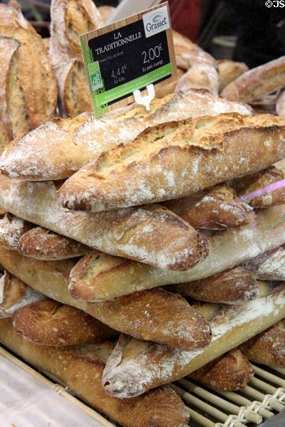 Bread stacks at Nimes market. Nimes, France.