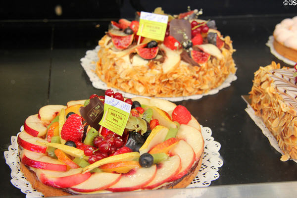 Cakes topped with fruit in Arles bakery. Arles, France.