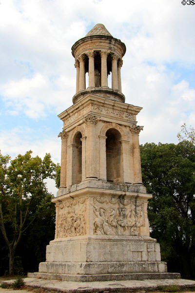 Mausoleum (30-20 BCE) (more a cenotaph since no remains found) with lower base showing historic reliefs, mid arches marking triumph & upper temple at Glanum Roman Ruins. Saint-Rémy-de-Provence, France.