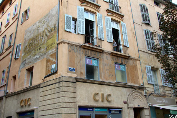 Revealed commercial painted signs including hat shop of father of painter Paul Cezanne on cours Mirabeau. Aix-en-Provence, France.