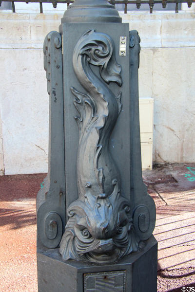 Sculpted dolphin on base of lampstand on La Canebière. Marseille, France.