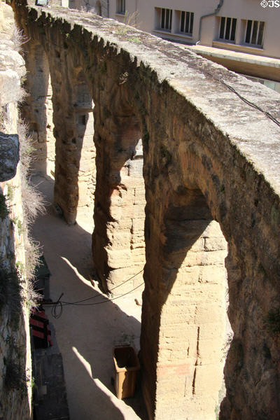 Arches ringing outer limits of seating area of Roman Theatre of Orange. Orange, France.