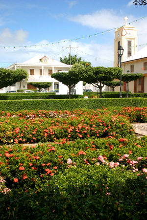 Flower covered central square & St François church. St François, Guadeloupe.