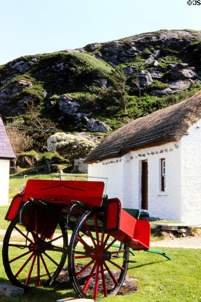 Traditional Irish wagon with fenders for passengers to sit sideways parked in Folk Village, Glencolumbkille. Ireland.