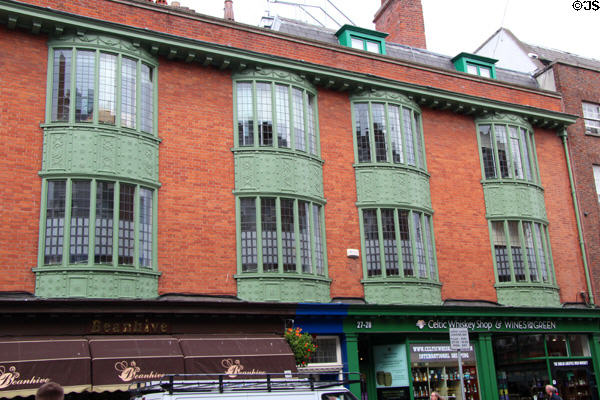 Bow window with Irish scrolls (27-28 Dawson St.). Dublin, Ireland.