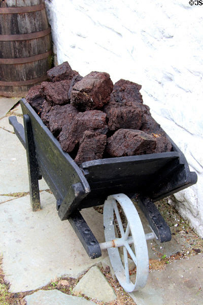 Cart carrying peat for heating at Muckross Traditional Farms in Killarney National Park. Killarney, Ireland.