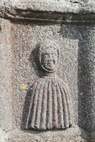 Cloister enclosure carving of caped figure between double columns at Jerpoint Abbey. Ireland.