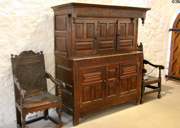 Chest & great chairs in banqueting hall at Cahir Castle. Cahir, Ireland.