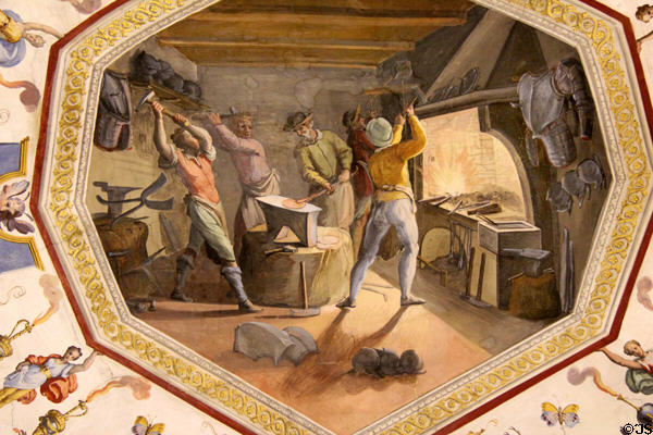 Painted view of forging of armor on ceiling at Uffizi Gallery. Florence, Italy.