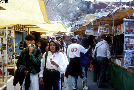 Shoppers eating ice cream in market. Mexico City, Mexico.