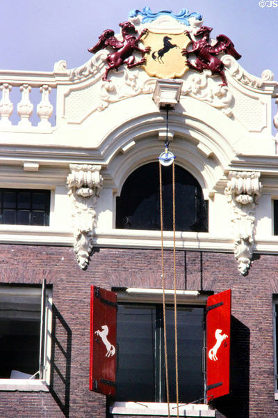 Stallions decorate gable of house on Herengracht. Amsterdam, Netherlands.