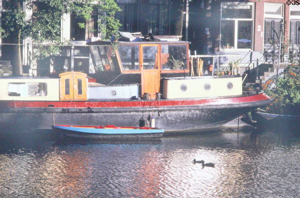 Houseboat on Zwanenburgwal near opera. Amsterdam, Netherlands.