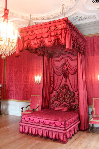 Crimson fabric dyed with cochineal on bed in bedchamber reserved for Queen Mary II. Het Loo, Netherlands.