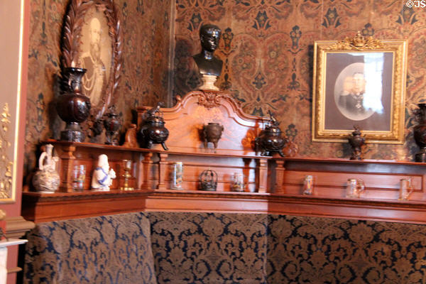 Rail of collectibles above seating bench in Drawing Room of Prince Hendrik. Het Loo, Netherlands.