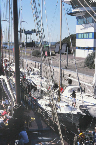 Boaters waiting in locks leading to sea in Afsluitdijk. Netherlands.