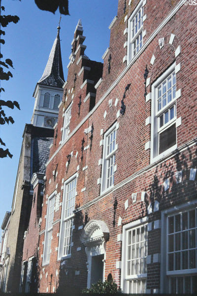 The buildings of a street on small canal. Sloten, Netherlands.