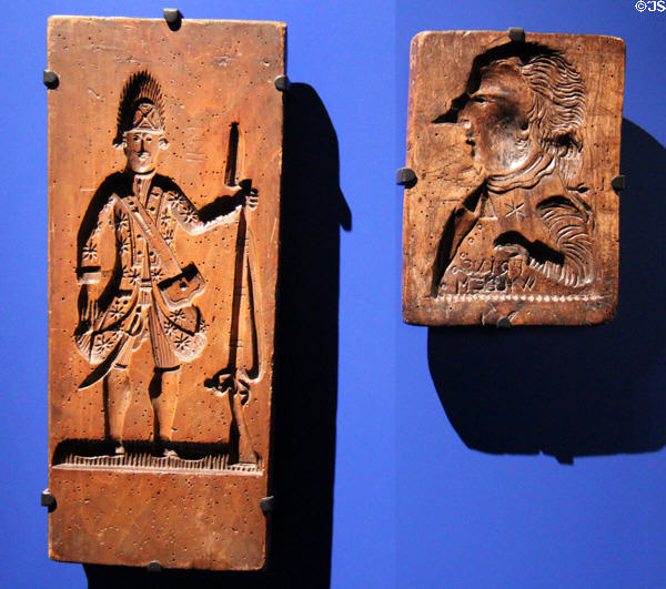 Wooden cookie molds (last quarter of 18thC) where resulting cookies represent political affiliation of buyers at ANNO Stadsmuseum Zwolle. Zwolle, Netherlands.