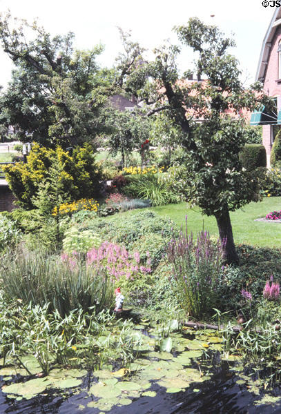Garden by canal in Westbroek. Westbroek, Netherlands.
