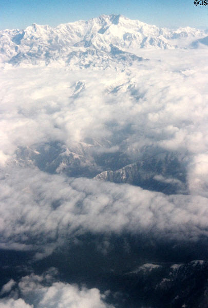 Clouds almost hide Himalayas over Nepal.