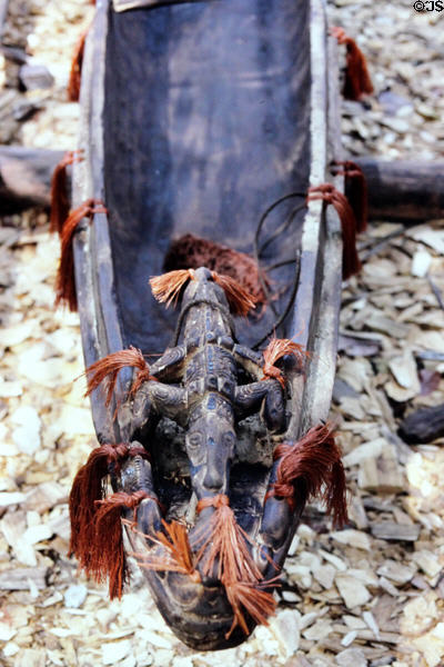 Carved and tasseled crocodile canoe spirit head in Mendam. Papua New Guinea.