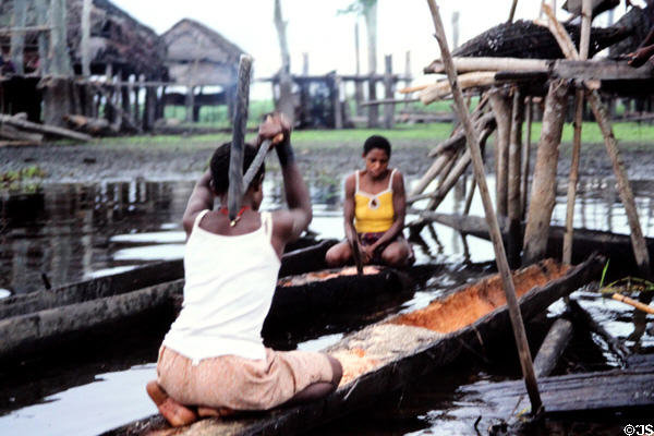 Flailing flour in a floating canoe at Kamburamba. Papua New Guinea.