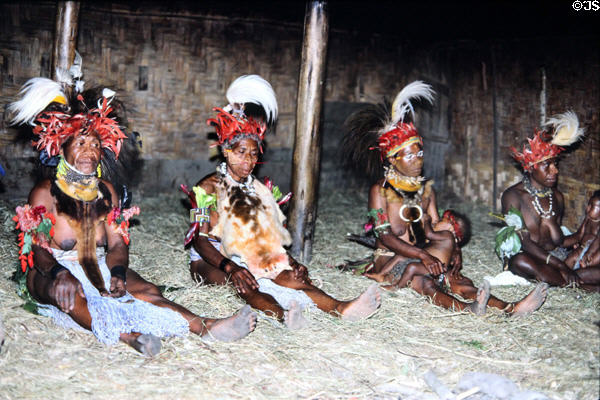 Seated women participating in a courtship ritual near Banz. Papua New Guinea.