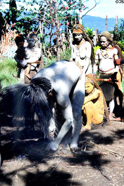 Demonstrating how to start fire with friction at Mudmen village. Papua New Guinea.