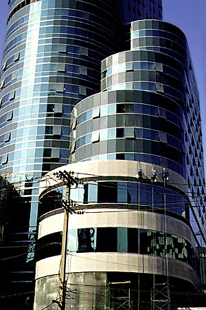 Modern glass skyscraper on Rama I Road, Bangkok. Thailand.