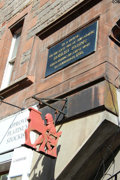 Sign on Royal Mile pointing to Lady Stair's Close where Writers' Museum marks site that Robert Burns lived on his first visit to Edinburgh. Edinburgh, Scotland.